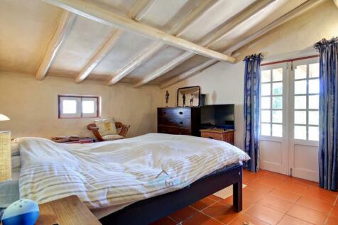 bedroom with patio doors to wraparound covered terrace