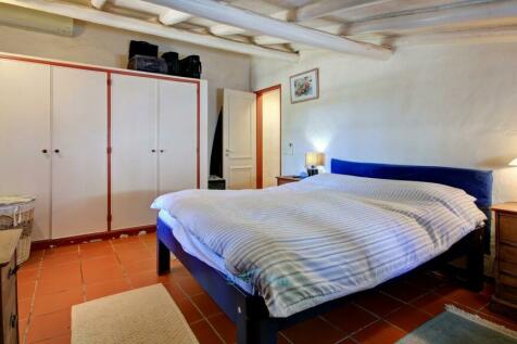 bedroom with built in wardrobes and air-conditioning