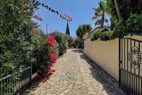 automatic gates and paved driveway