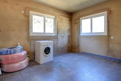 another room with plumbing for washing machine