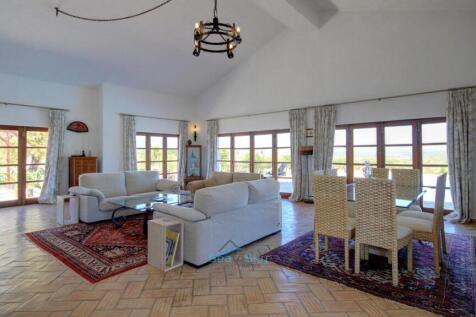wall of windows flooding living area with natural light