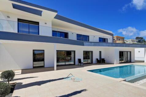 twin patio doors to the pool area