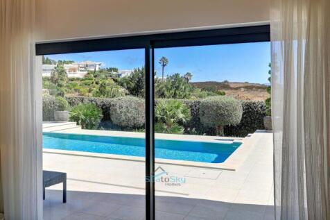 twin patio doors to the pool area