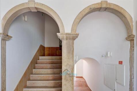 entrance with original stone arches