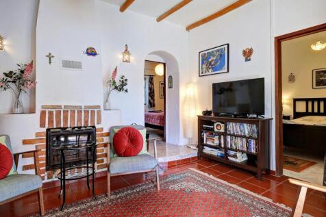 lounge with doors to 2 bedrooms