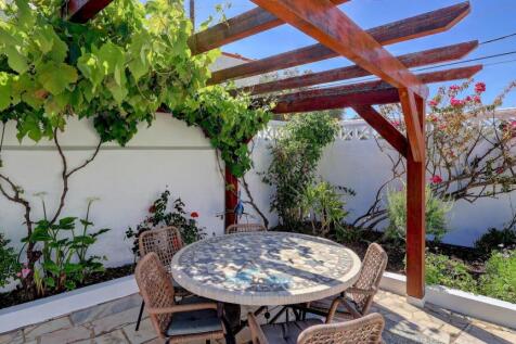 pergola with grape vines