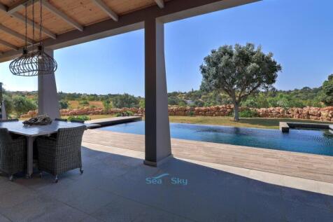 large covered terrace overlooking the pool