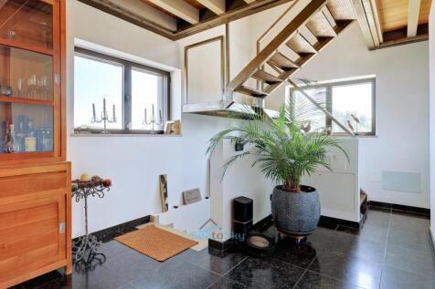 stairs lead up to mezzanine