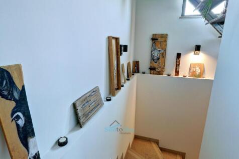 stairs down to utility rooms &amp; garage