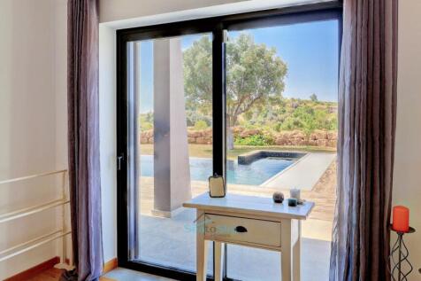 patio door to the pool and garden