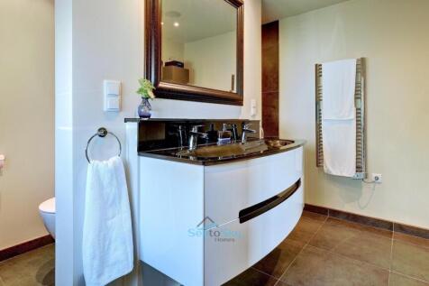 with double sinks and walk-in shower