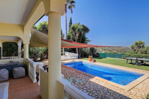 doors to terrace overlooking pool