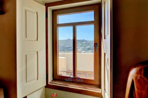 view over the rooftops to hills