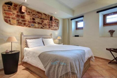 bedroom with exposed oak beams