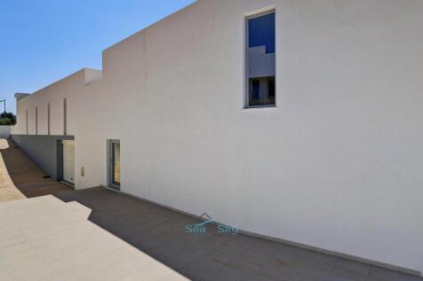driveway, garage and door to living room
