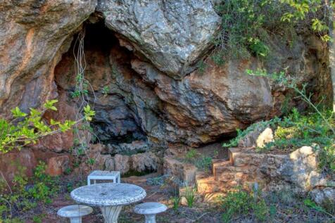 natural rock cave with well