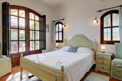 bedroom 4 with patio doors to pool terrace