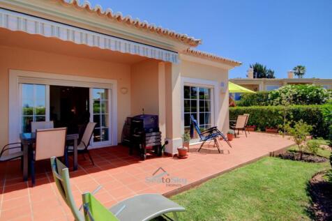 paved terrace and lawns