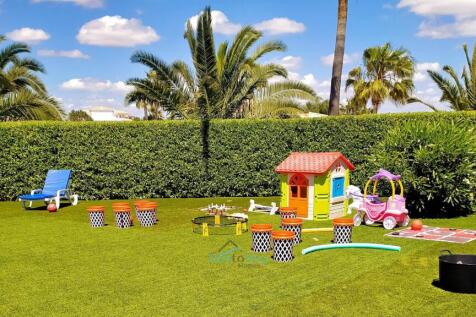 communal grassy children&#39;s playarea