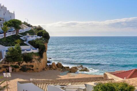 lovely sandy beach nestled between the cliffs