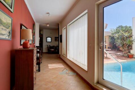 door to pool opposite bedroom