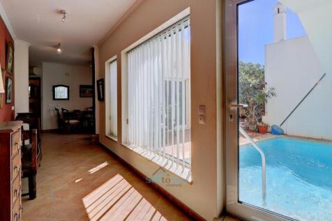 door to pool opposite bedroom