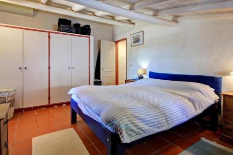 bedroom with built in wardrobes and air-conditioning
