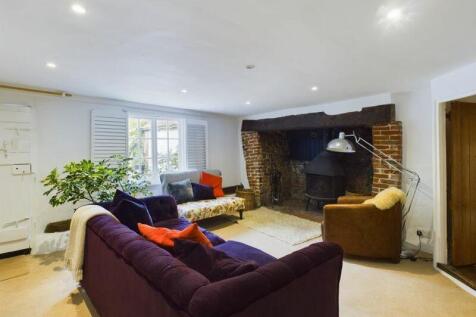 Cottage sitting room with inglenook