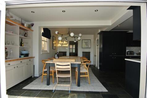 Dining framed by bi-folds.JPG