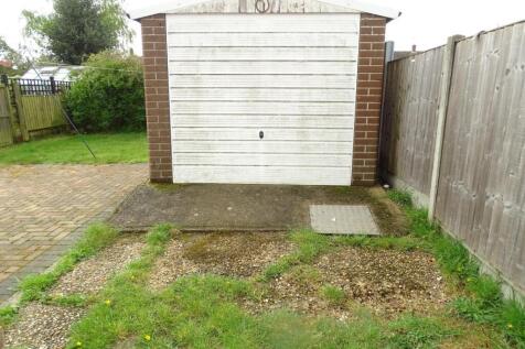 AMPLE DRIVEWAY PARKING AND DETACHED GARAGE