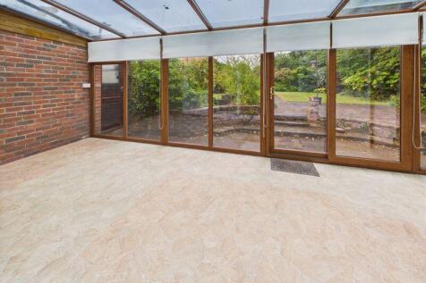 CONSERVATORY ON TO GARDEN