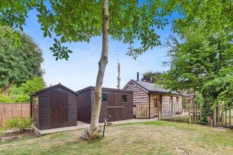 REAR GARDEN WITH TWO SHEDS