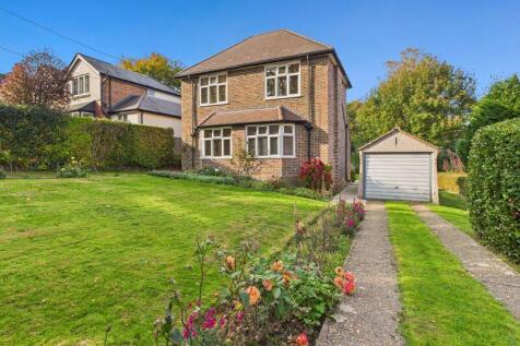 FRONT ASPECT AND DRIVEWAY TO GARAGE