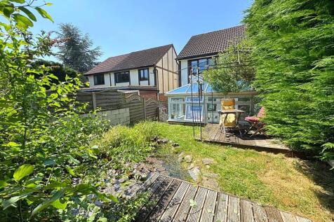Rear garden to ex...