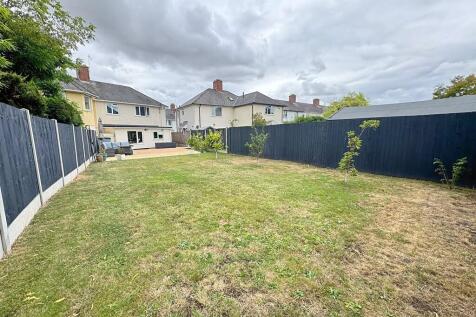 Rear garden to ex...