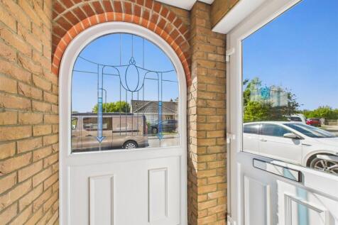 Covered front porch with door to: