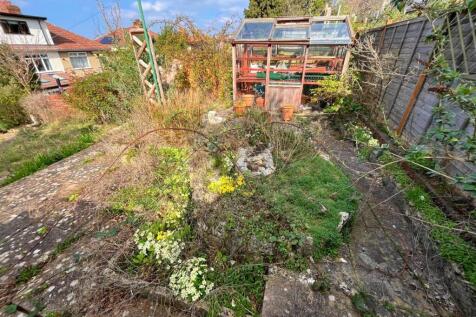 Top patio pond and greenhouse.jpg