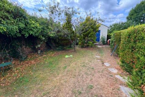 Rear lawn and garden room.jpg
