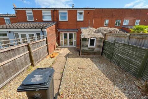 Rear view of property and patio (1).jpg
