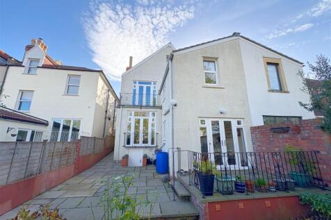 Rear view of property and patio (1).jpg