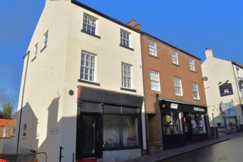 COTTAGE IS TO THE REAR OF THIS BUILDING