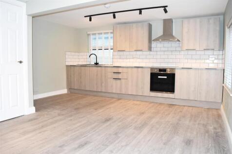 LOUNGE OPEN TO KITCHEN