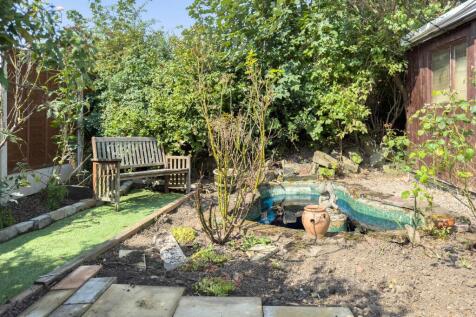 Relaxing rear garden with a pond