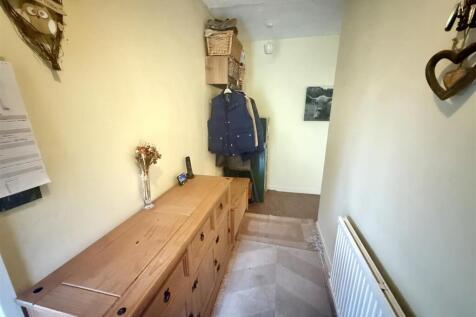 Front recessed entrance door to: