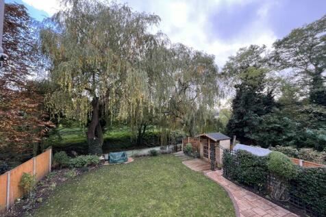 Overhead view of rear garden and rive...