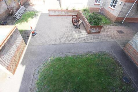 OUTSIDE to rear