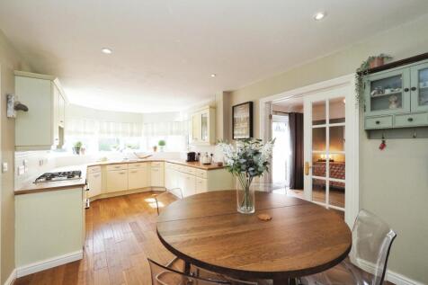 Stunning Open Plan Kitchen/Dining with Feature Window filtering through Natural Light