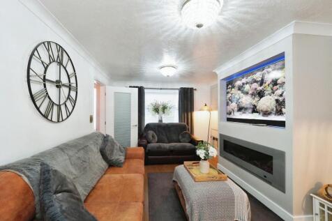 Stylish Lounge, spacious yet cosy with media wall and feature fire