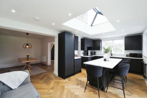 Breathtaking Kitchen and Dining Space filled with Natural Light