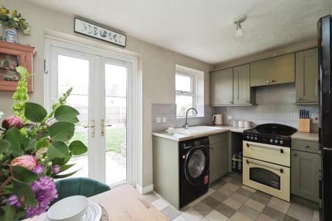 Bright Kitchen and Dining Space with Double Doors